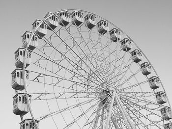 Low angle view of ferris wheel against sky