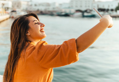 Side view of young woman looking away
