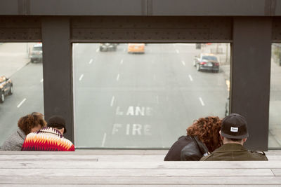 Rear view of people sitting in bus