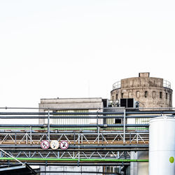 Low angle view of factory against clear sky