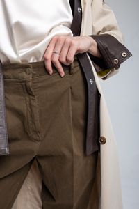 Midsection of man holding bag