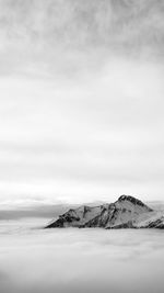 Scenic view of snowcapped mountain against sky