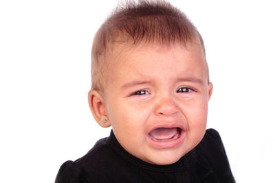 Portrait of cute boy against white background