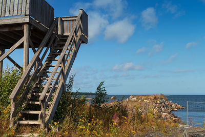 An old wooden guard tower is standing by the jetty at the fishing harbor of kalajoki, finland.