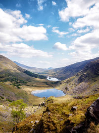 Scenic view of landscape and mountains against sky