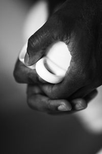 Close-up of hands holding baby