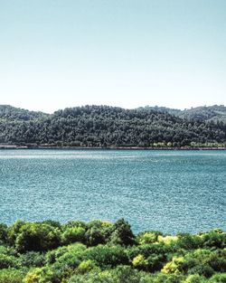 Scenic view of lake against clear sky