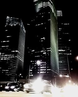 Low angle view of modern building at night