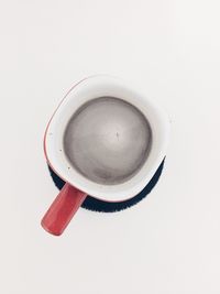 High angle view of coffee cup on white background