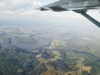 Aerial view of landscape seen through airplane window