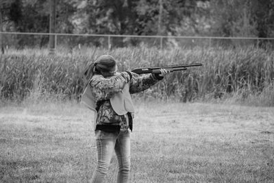 Boy playing on grassy field