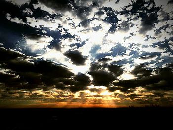 Silhouette of tree against sunset sky