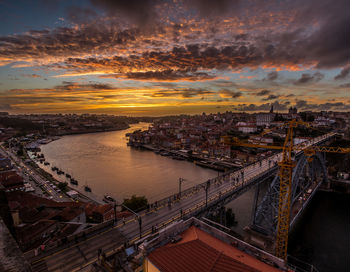 High angle view of bridge over river against sky at sunset