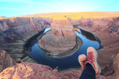 Low section of woman resting at horseshoe canyon