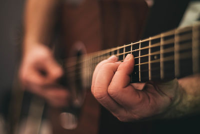 Cropped image of musician playing guitar