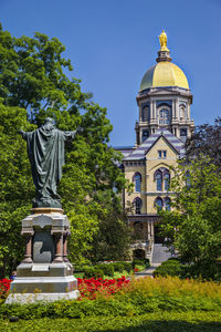 University of notre dame against clear blue sky in city