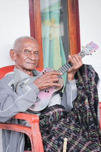 Full length portrait of man playing outdoors