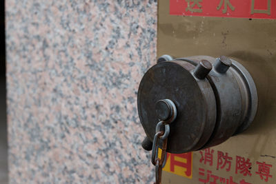 Close-up of metallic object on wall