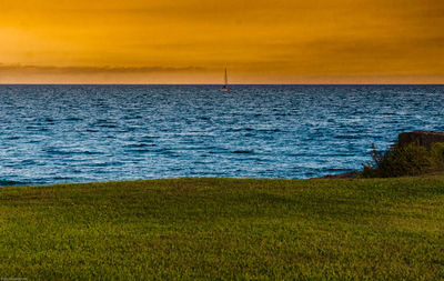 Scenic view of sea against sky during sunset