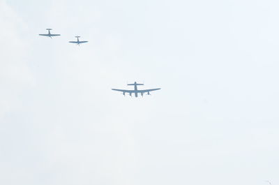 Low angle view of airplane flying in sky