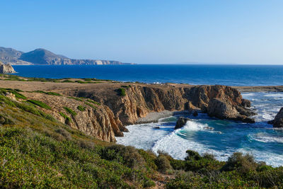 Scenic view of sea against clear blue sky