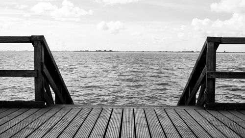 Pier over sea against sky