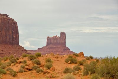 Rock formations on landscape against sky