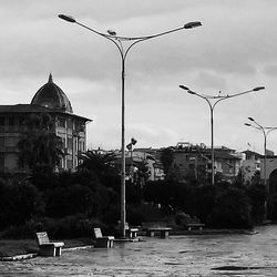 Buildings against cloudy sky