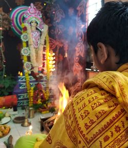 Portrait of man at illuminated temple