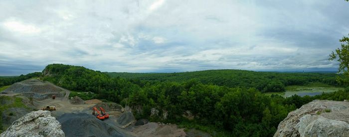 Scenic view of landscape against cloudy sky