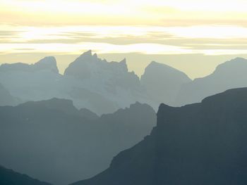 Scenic view of mountains against sky during sunset