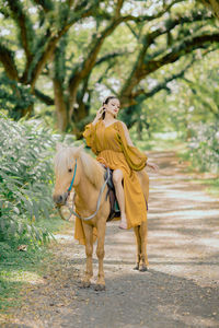 Portrait of woman standing in park