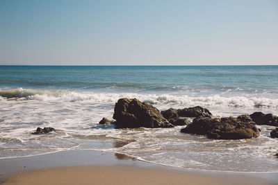 Scenic view of sea against clear sky