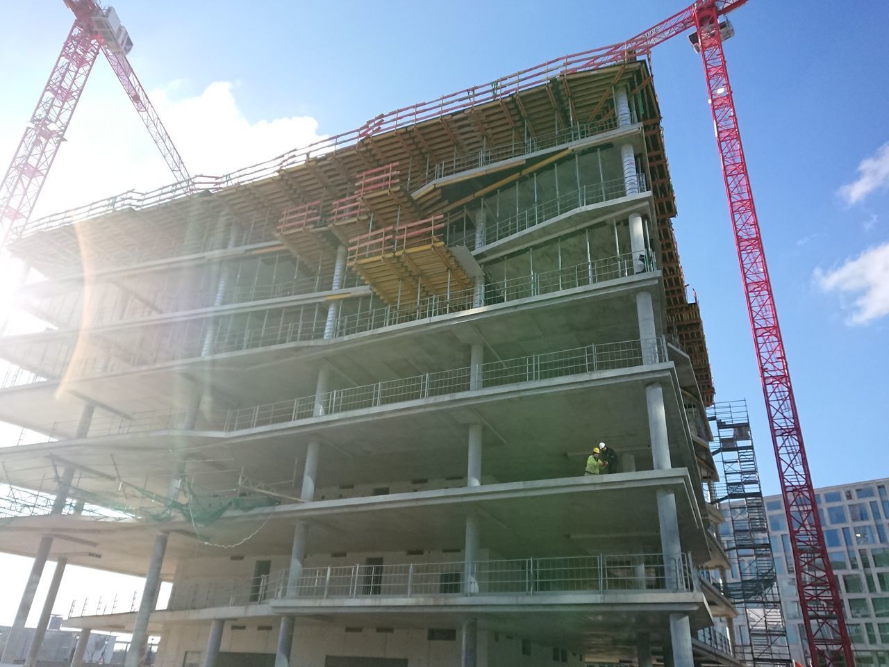 LOW ANGLE VIEW OF CONSTRUCTION SITE AGAINST BUILDING