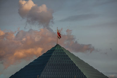 Low angle view of flag against sky during sunset