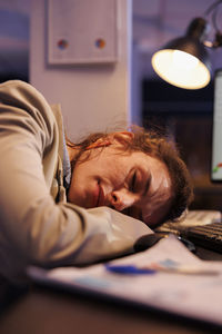 Young woman using mobile phone at home