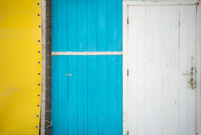 Closed blue white yellow door
