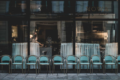 Chairs against brick wall