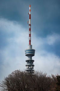 Low angle view of a broadcasting tower against sky