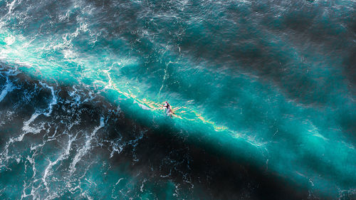 High angle view of people in sea