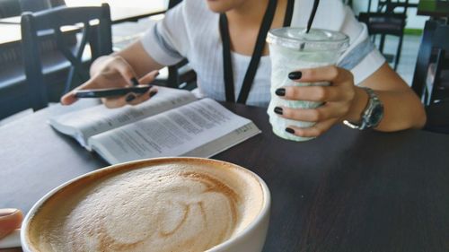 Person holding coffee cup