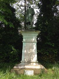 Statue of woman in park