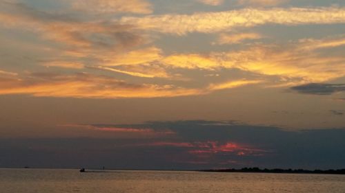 Scenic view of sea at sunset