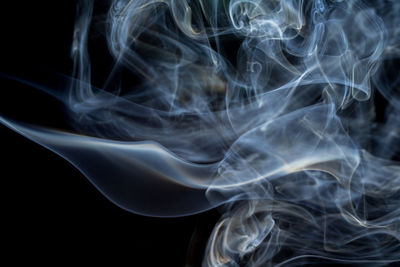 Close-up of smoke against black background