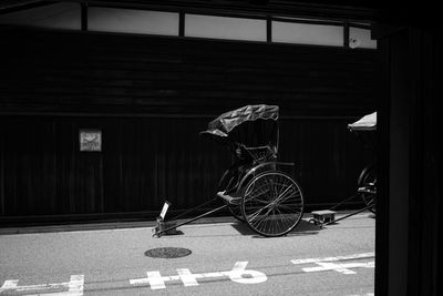 Bicycle on road against buildings in city