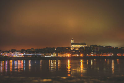 Illuminated city at waterfront