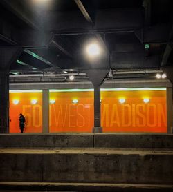 Illuminated railroad station at night