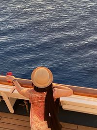 Rear view of woman in boat at sea