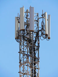 Low angle view of communications tower against clear sky