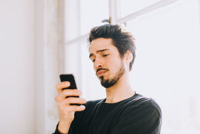 Young man using mobile phone